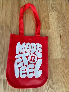 lululemon athletica Red Tote with White "Made to Feel" Graphic